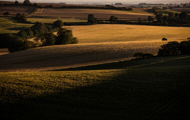 Near Belchford, Lincolnshire, UK, July 2017, View of fields at sunset near the Bluestone Heath Road in the Lincolnshire Wolds