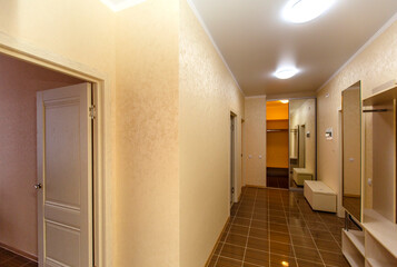 An entrance hall in an apartment with doors leading to different rooms