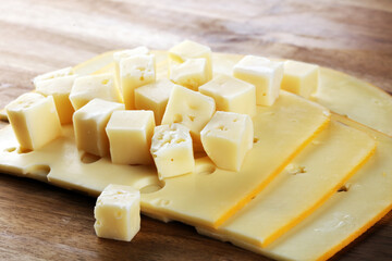 cheese cubes on vintage table with parsley.