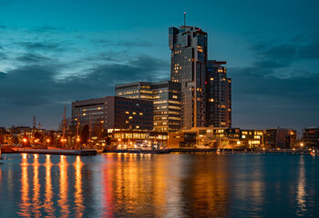 Fototapeta na wymiar Modern architecture of Sea Towers skyscraper at night in Gdynia, Poland. 
