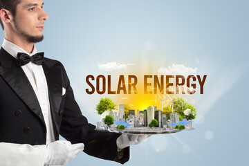 Waiter serving eco city with SOLAR ENERGY inscription, renewabke energy concept