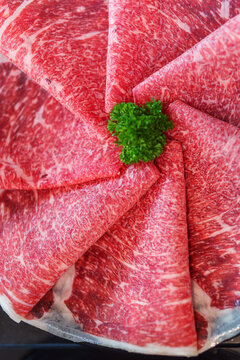 Close up. Sliced raw wagyu premium Japanese beef beautifully stacked