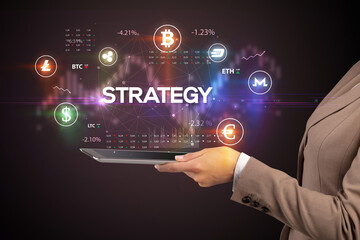 Close-up of a touchscreen with STRATEGY inscription, business opportunity concept