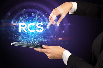 Close-up of a touchscreen with RCS abbreviation, modern technology concept