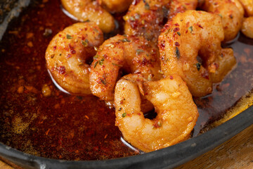 Roasted (fried) big shrimps in tomato sauce with olive oil, garlic, cilantro and soy sauce...
