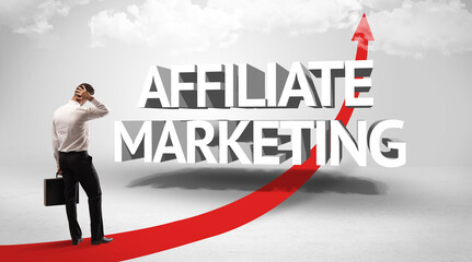 Rear view of a businessman standing in front of AFFILIATE MARKETING inscription, successful business concept