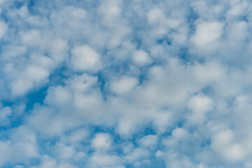 fluffy clouds on a blue background