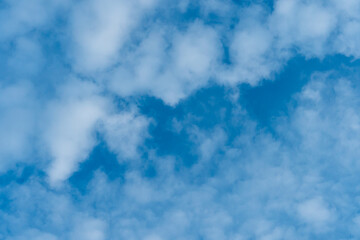 Obraz premium fluffy clouds on a blue background