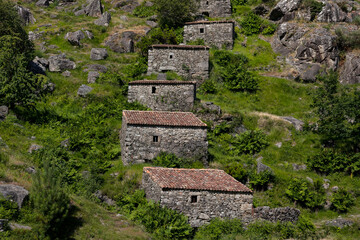 Fototapeta na wymiar Water mills in the mountains of Galicia in a hiking route called Muiños do Folon e do Picon. O Rosal, Galicia, Spain