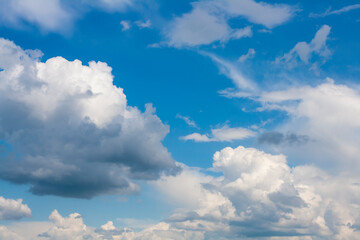 Clouds in the blue heaven. Sky background.