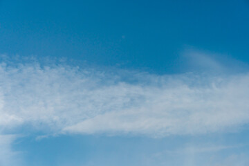 Naklejka na ściany i meble fluffy clouds on a blue background