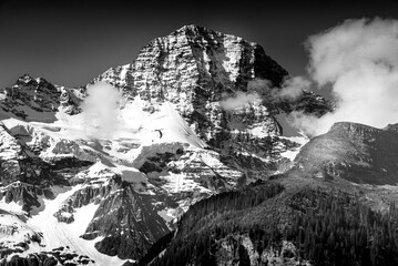 Paraglider in front of Eiger north face in black and white