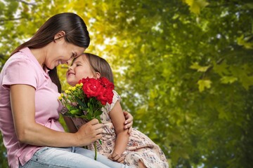 Happy mother and child giving her flowers