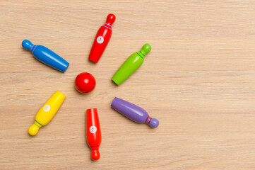Wooden bowling toys on the table. Kid game concept