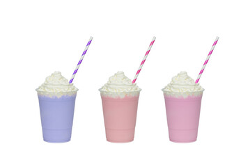 Colourful milkshakes covered with whipped cream in plastic glass isolated on white background
