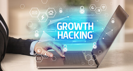 GROWTH HACKING inscription on laptop, internet security and data protection concept, blockchain and cybersecurity