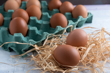 Chicken eggs broken in the middle of other eggs. Top view