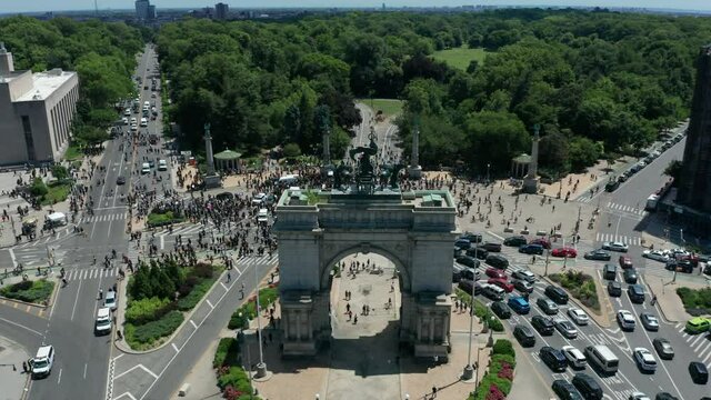 alt flying over arch towards revealing huge BLM protest at Grand Army Plaza in Brooklyn
