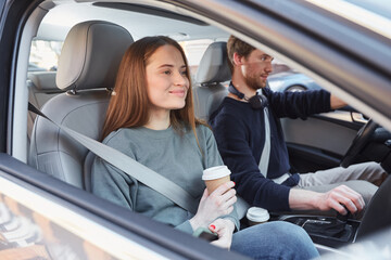 Adorable young lady being pleased with car trip