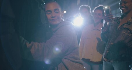 Woman embraces a cop that patrols during the protests as a sign of peace. Group of people filming a woman hugging a policeman during the anti-government demonstration.
