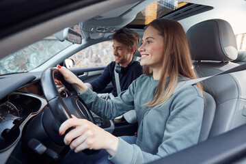 Positive pretty lady travelling with her boyfriend by car