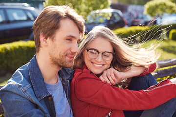 Joyful young couple spending weekend in fresh air