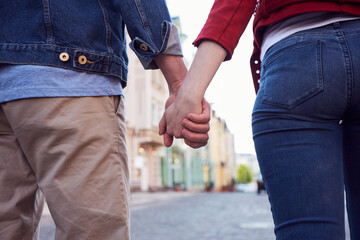 Lovely man and woman having pleasant stroll together