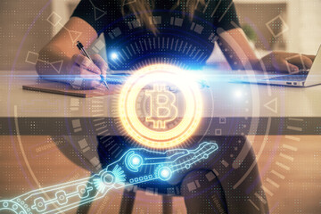 Double exposure of woman hands typing on computer and crypto market theme hologram drawing. Blockchain concept.