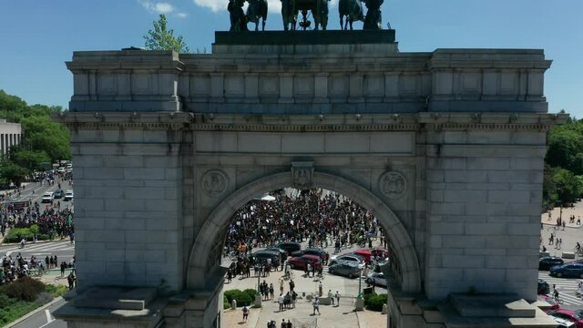 rising over arch reveal of huge BLM protest in Grand Army Plaza Brooklyn