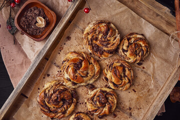 Buns with chocolate and cinnamon as cake food concept. Top view