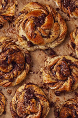 Buns with chocolate and cinnamon as cake food concept. Top view. Close up image