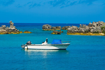 White yacht docking in the harbor of St. George’s Bermuda