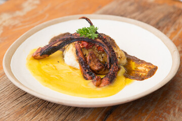 white fish and octopus with baroa potato pure