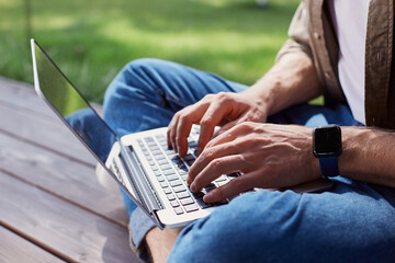 Busy man completing his tasks on laptop