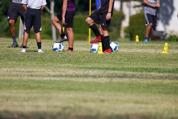soccer player kicking ball