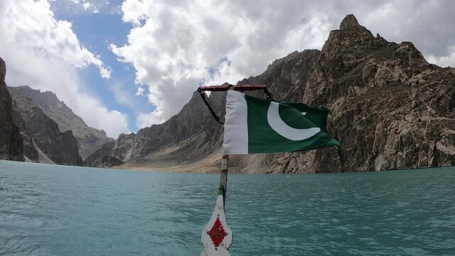 Pakistan Flag on the boat in a beautiful lake, attabad lake in gilgit baltistan, Pakistan