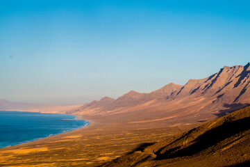 Landscape of Panoramic vulcanic mountains and Atlantic Ocean ,  dunes of coralejo and Gran Tarajal Port in Fuerteventura, Lanzarote 
