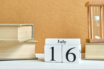 16th july sixteenth day month calendar concept on wooden blocks.