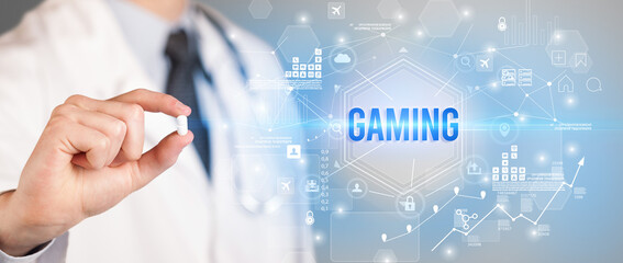 Doctor giving a pill with GAMING inscription, new technology solution concept