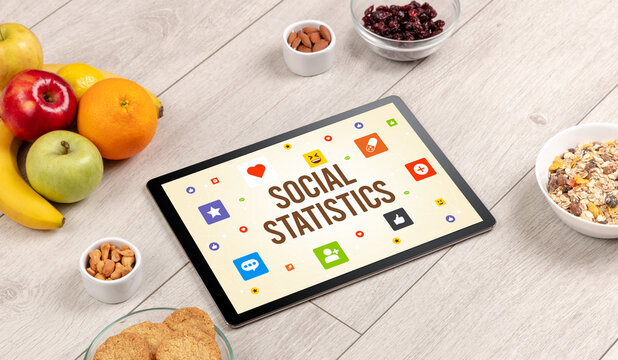 Healthy Tablet Pc compostion with SOCIAL STATISTICS inscription, Social networking concept