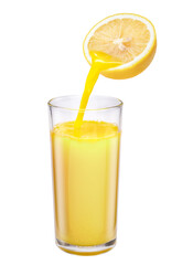 Fresh lemon juice pours into the lemon juice glass isolated on white background. With clipping path