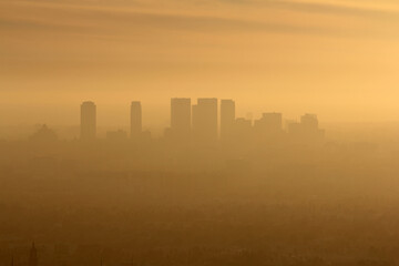 Obraz premium Smoggy foggy afternoon view of Century City and west Los Angeles in Southern California.