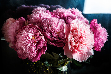 elegant bouquet made from many large pink and purple peonies