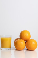 Glass of orange juice with fruits