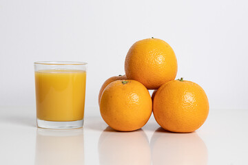 Glass of orange juice with fruits