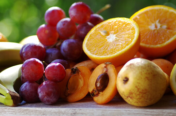 Naklejka na ściany i meble Slices of loquat fruits, grapes and citric fruits