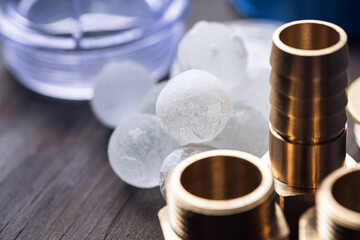 Plumbing. Different wrenches, pipe, tube, fittings and connectors on a wooden rustic table.