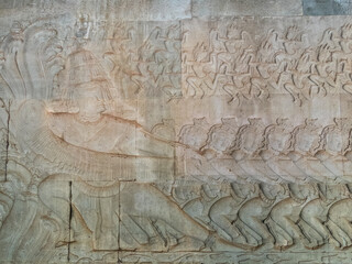 Bas-relief of Ravana holding the head of the serpent at Angkor Wat - Siem Reap, Cambodia