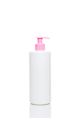 White lotion bottle with pink pump isolated on white background. Vertical