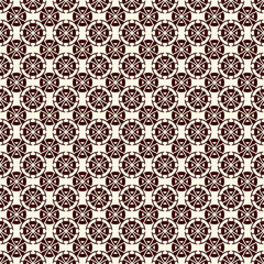 Ethnic, tribal wallpaper. Repeated segmented circles seamless pattern. Openwork ornament. Delicate ornamental background